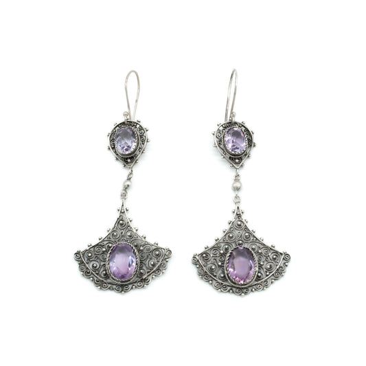 Large silver drop earrings with intricate filigree detail, each set with two beautifully faceted amethysts. Circa 1930’s