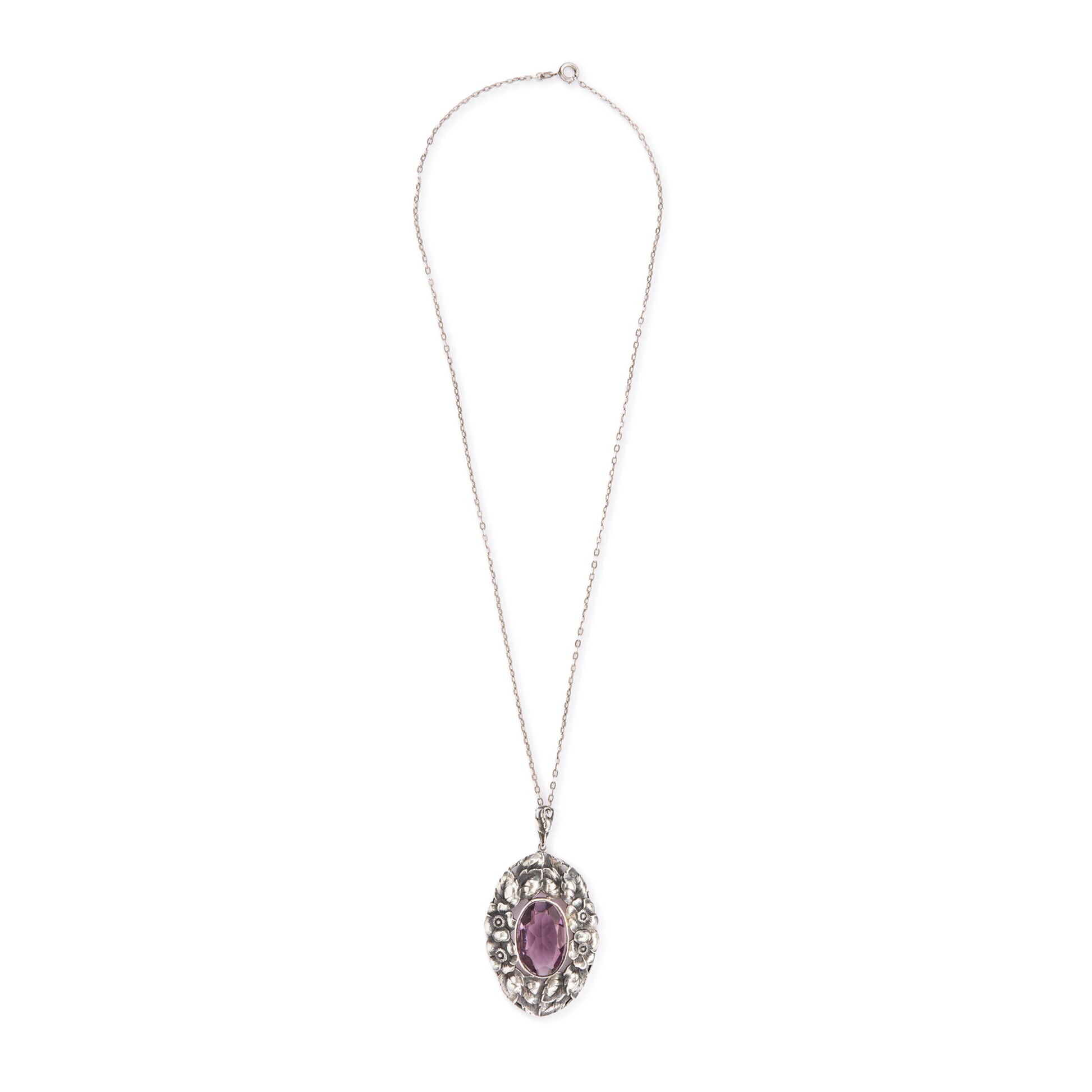 Very ornate oval pendant with a beautifully faceted purple amethyst in a floral setting, on a silver chain. 800 Silver. German