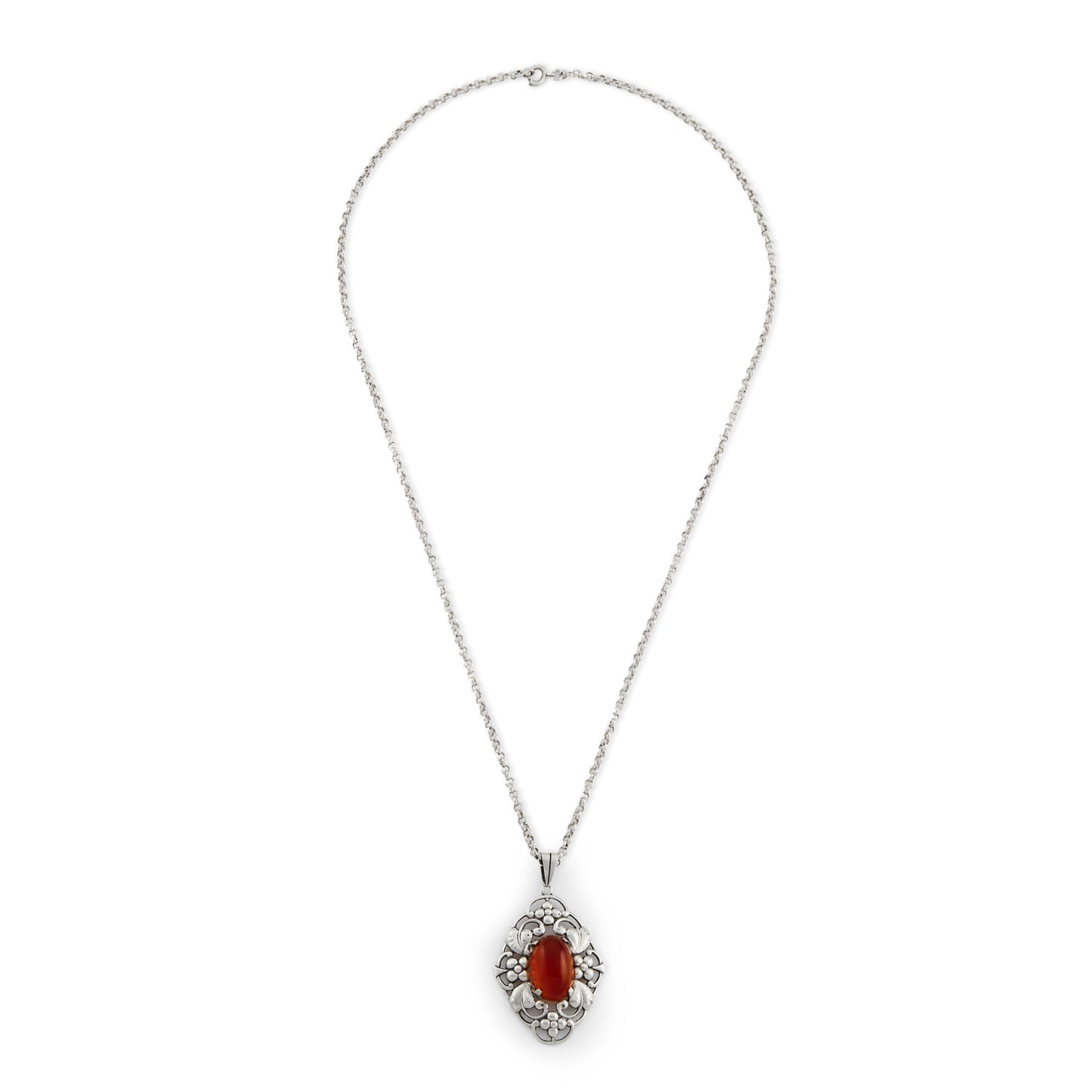 Lovely silver Arts and Crafts pendant set with an oval cabochon carnelian, on a vintage silver chain. Circa 1910