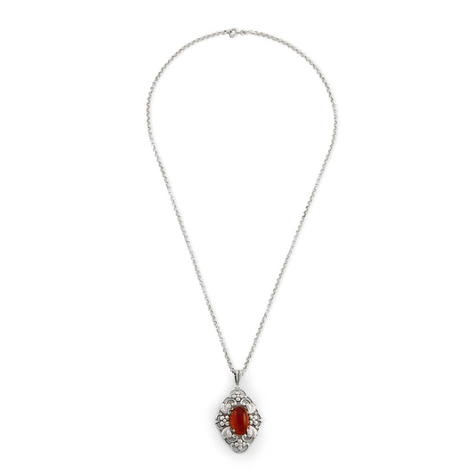 Lovely silver Arts and Crafts pendant set with an oval cabochon carnelian, on a vintage silver chain. Circa 1910