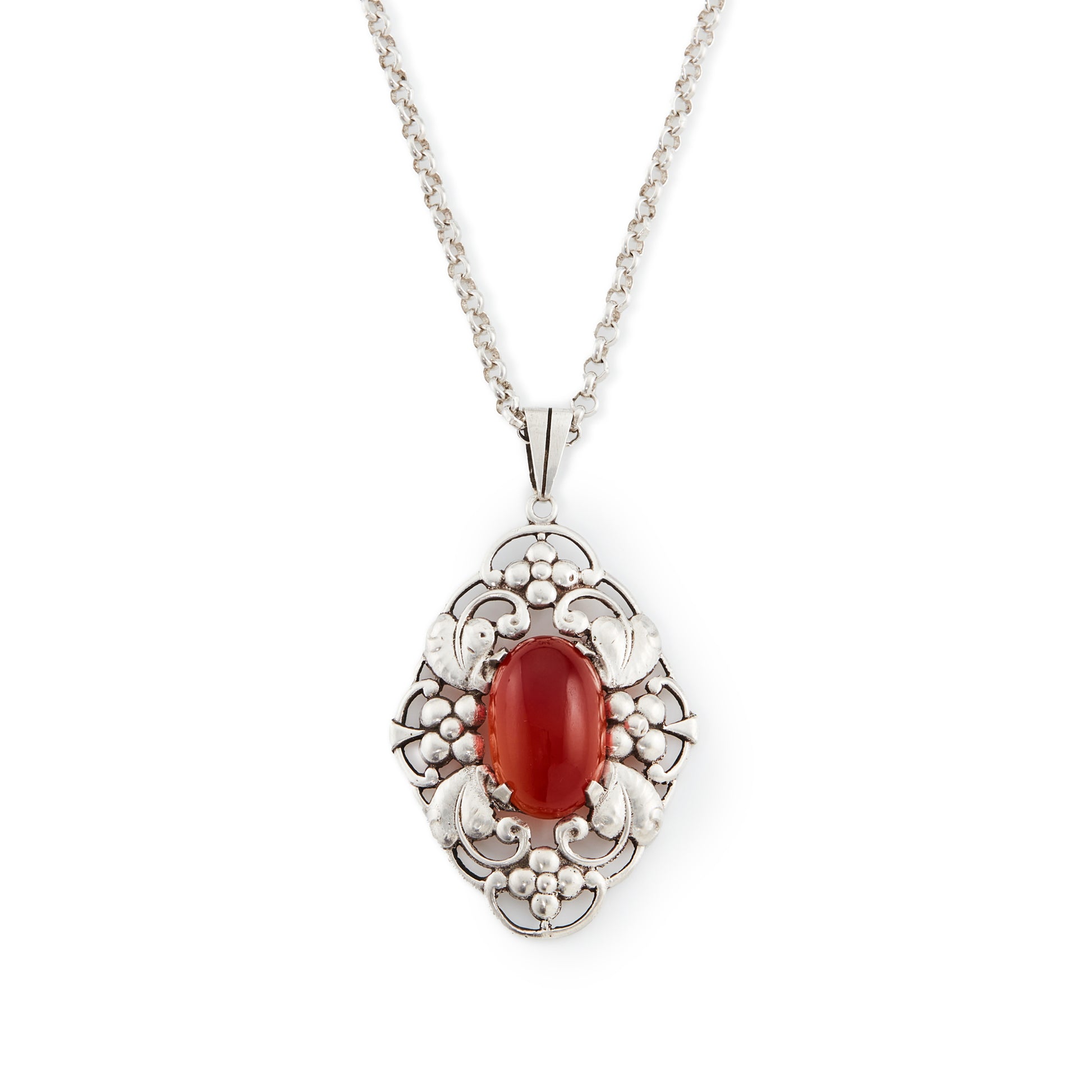 Lovely silver Arts and Crafts pendant set with an oval cabochon carnelian, on a vintage silver chain. Circa 1910