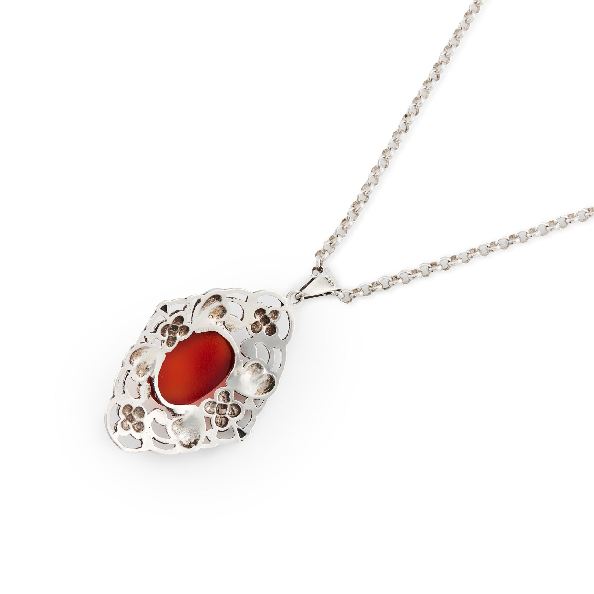 Lovely silver Arts and Crafts pendant set with an oval cabochon carnelian, on a vintage silver chain. Circa 1910