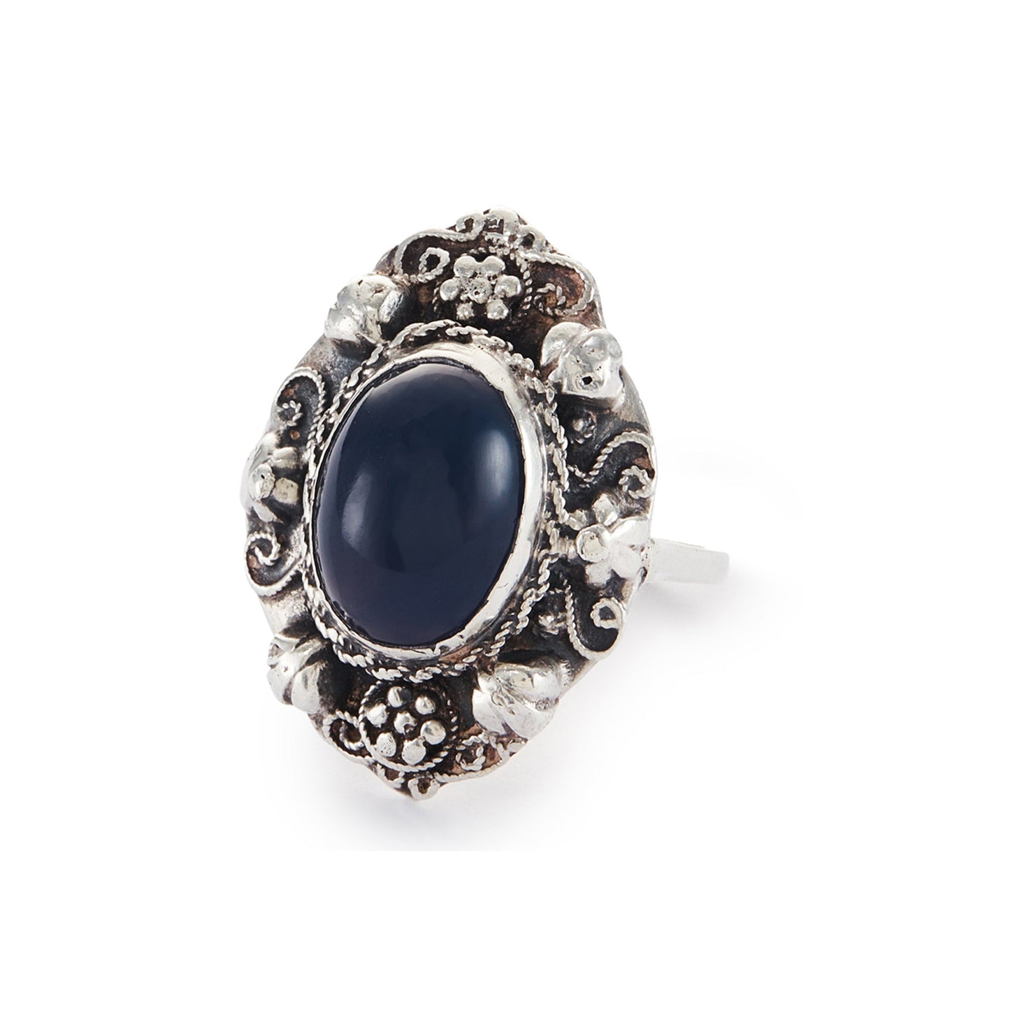 Lovely silver Arts and Crafts ring set with a cabochon sodalite, surrounded by intricate floral detail.
