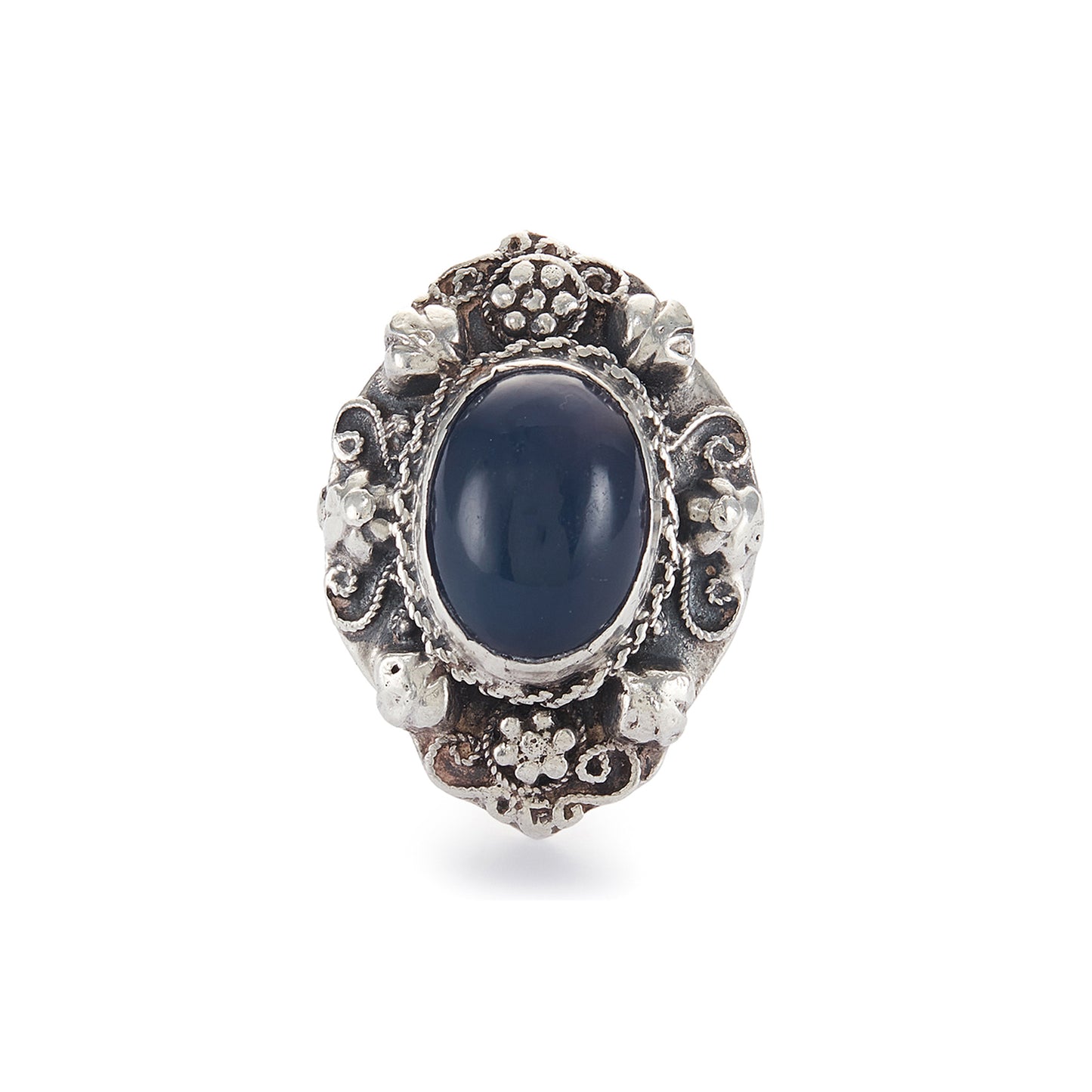 Lovely silver Arts and Crafts ring set with a cabochon sodalite, surrounded by intricate floral detail.