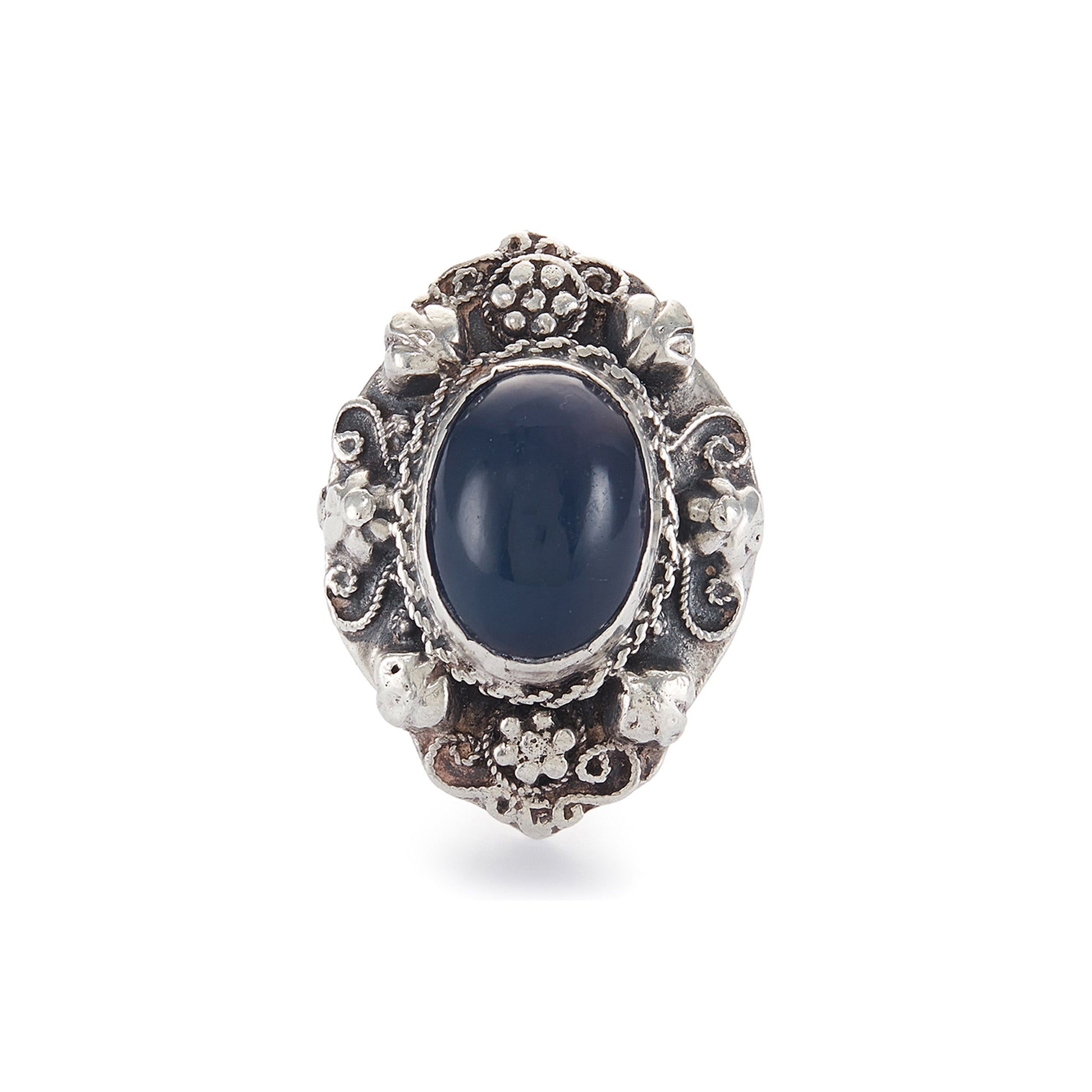 Lovely silver Arts and Crafts ring set with a cabochon sodalite, surrounded by intricate floral detail.