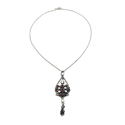 Intricate silver Austro-Hungarian garnet and pearl pendant with dangling drops, on a silver chain.   Circa 1910