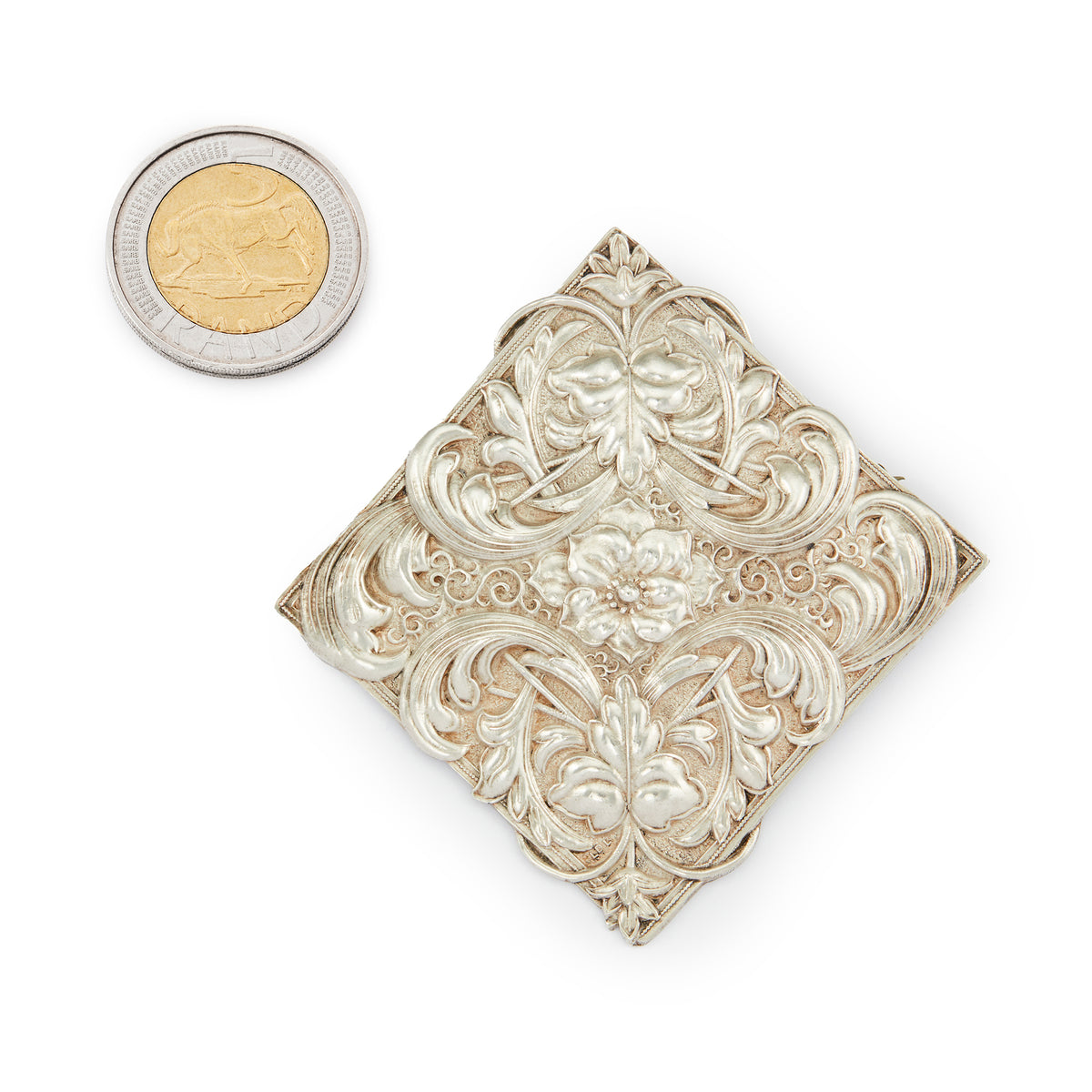 Impressive Mid-Century sterling silver Candida brooch with an intricate repoussé floral design.