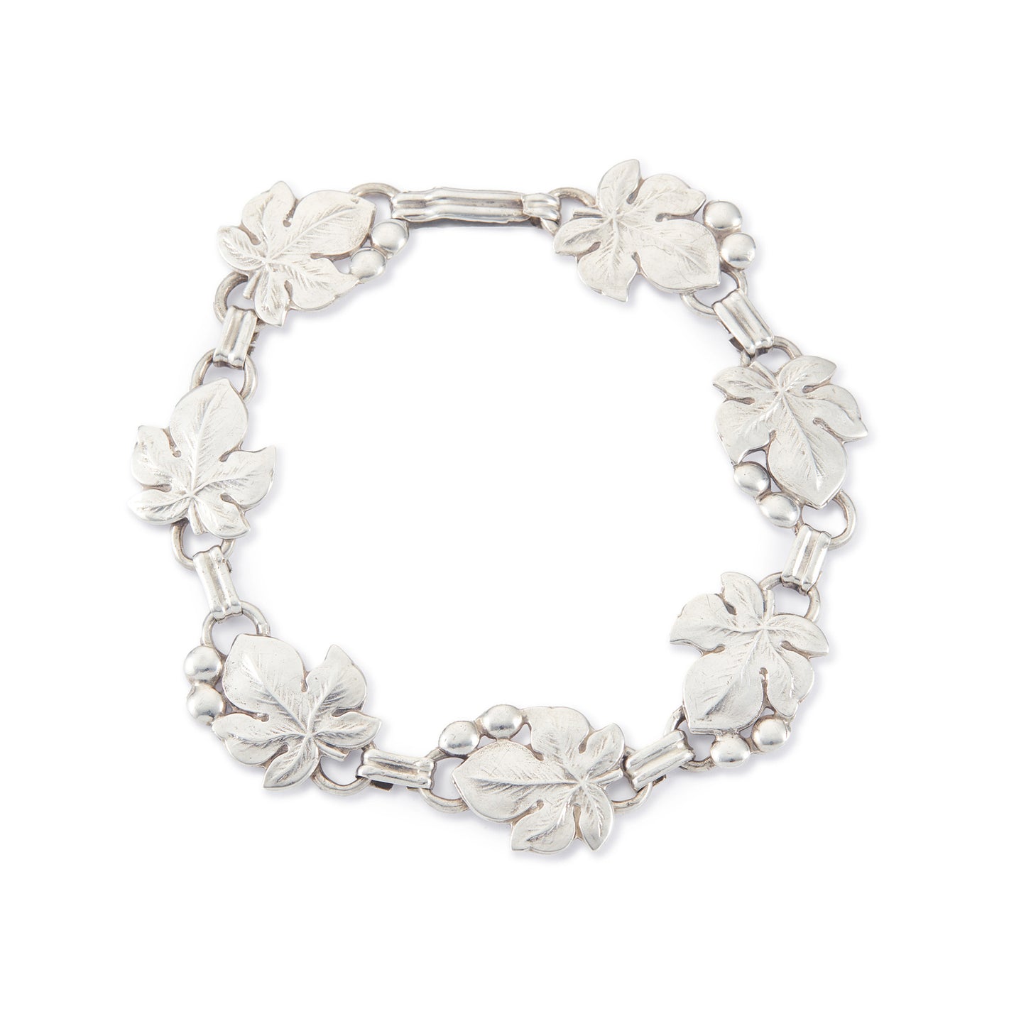Classic silver Candida bracelet (unmarked) with seven linked grape vine leaves.