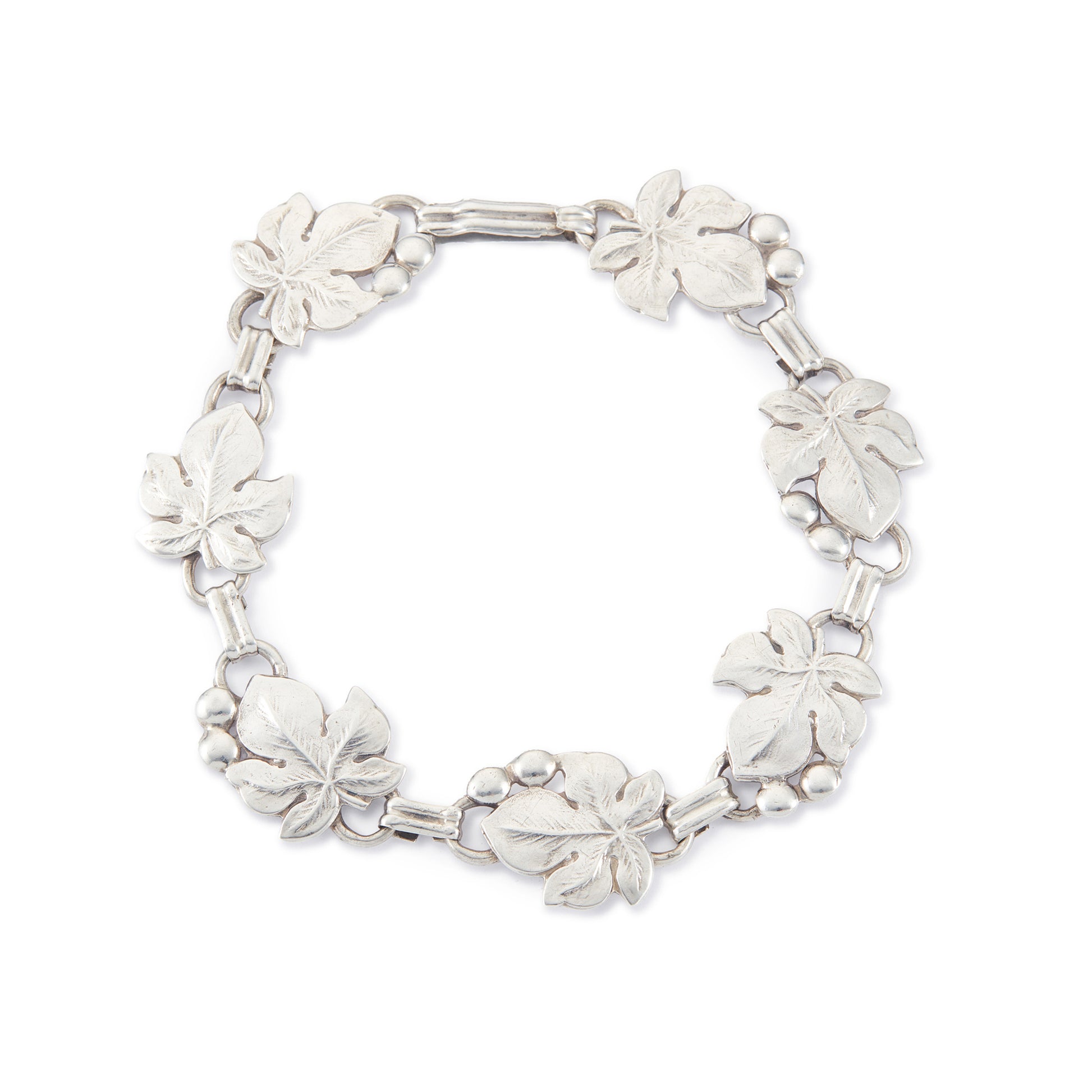Classic silver Candida bracelet (unmarked) with seven linked grape vine leaves.