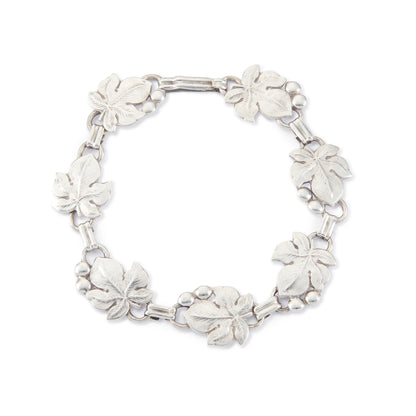 Classic silver Candida bracelet (unmarked) with seven linked grape vine leaves.