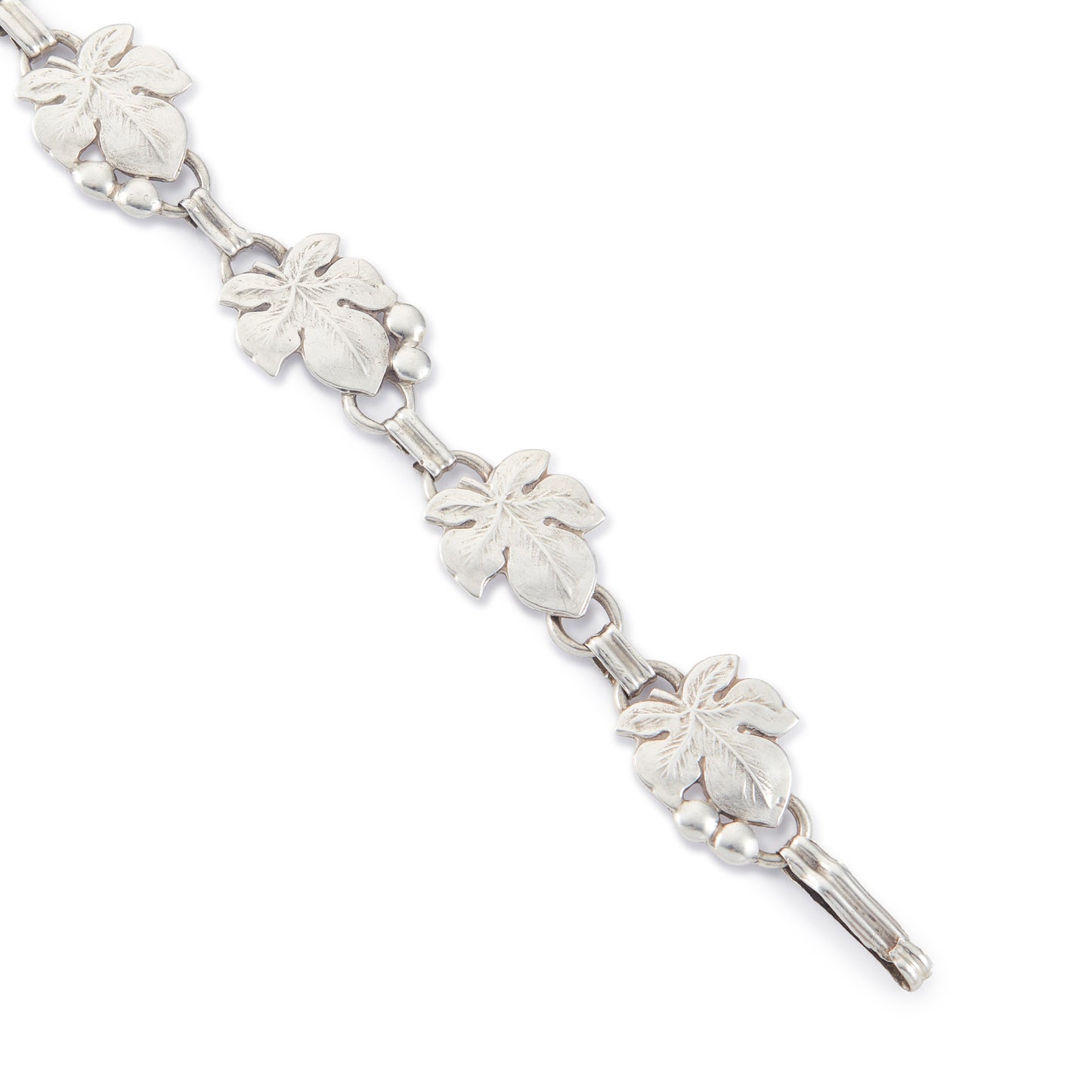 Classic silver Candida bracelet (unmarked) with seven linked grape vine leaves.