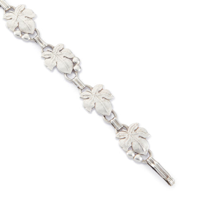 Classic silver Candida bracelet (unmarked) with seven linked grape vine leaves.