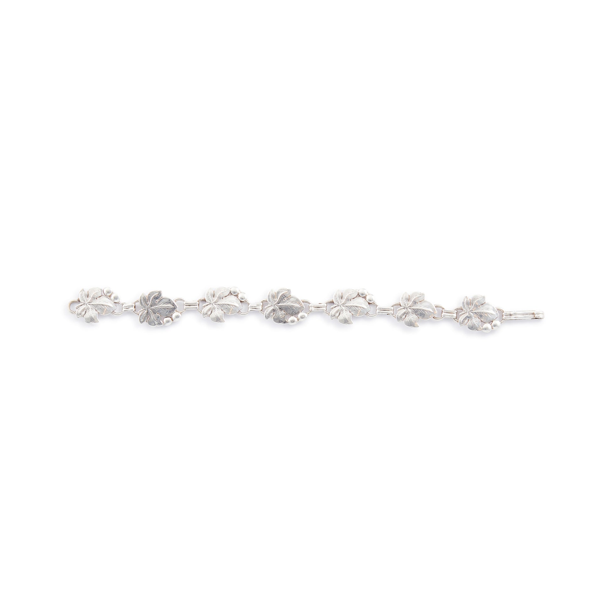 Classic silver Candida bracelet (unmarked) with seven linked grape vine leaves.