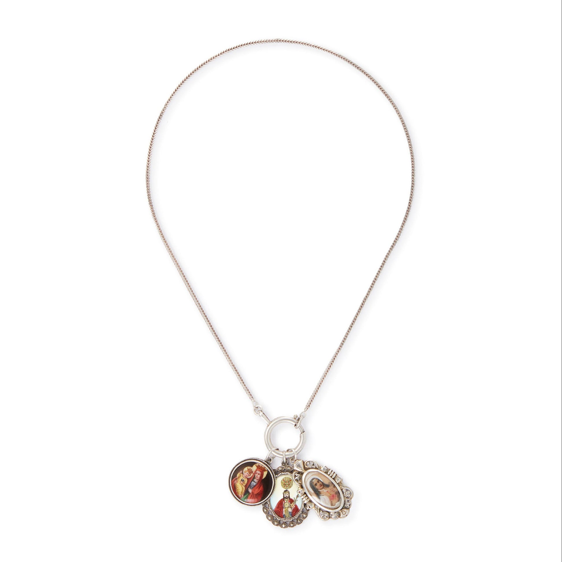 Vintage silver chain with three stunning antique religious silver pendants hanging from a large silver bolt ring clasp, one porcelain, one enamelled in a marcasite setting and one hand-painted, in an elaborate silver setting.
