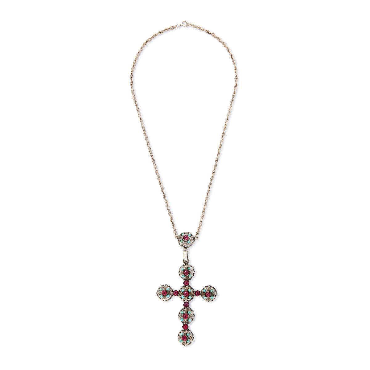 Spectacular large Edwardian cross pendant set with sixteen cabochon turquoise stones and eleven vibrant purple glass stones, on a silver rope chain.