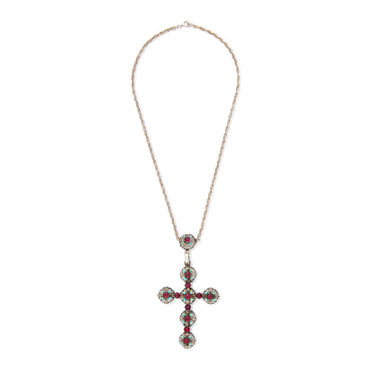 Spectacular large Edwardian cross pendant set with sixteen cabochon turquoise stones and eleven vibrant purple glass stones, on a silver rope chain.