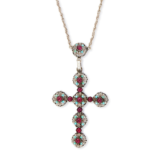 Spectacular large Edwardian cross pendant set with sixteen cabochon turquoise stones and eleven vibrant purple glass stones, on a silver rope chain.