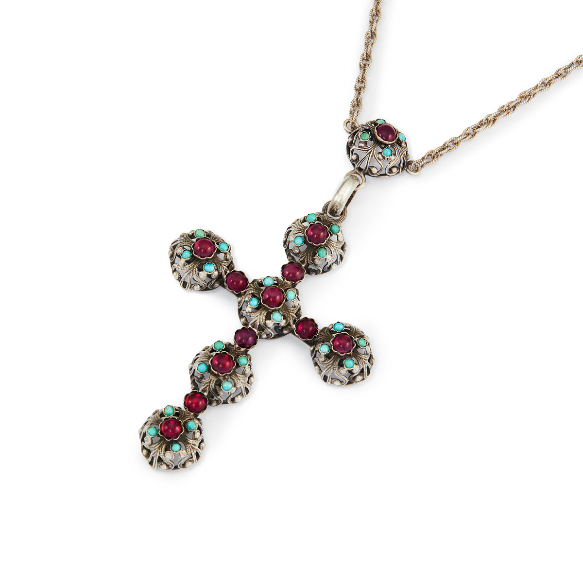 Spectacular large Edwardian cross pendant set with sixteen cabochon turquoise stones and eleven vibrant purple glass stones, on a silver rope chain.