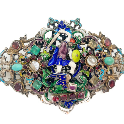 Magnificent large silver gilt Austro-Hungarian enamelled belt buckle depicting Saint George slaying the dragon (The Golden Legend).

This extraordinary and highly collectable piece is set with emeralds, garnets, natural pearls, citrines, rubies and turquoise stones.

Circa 1880