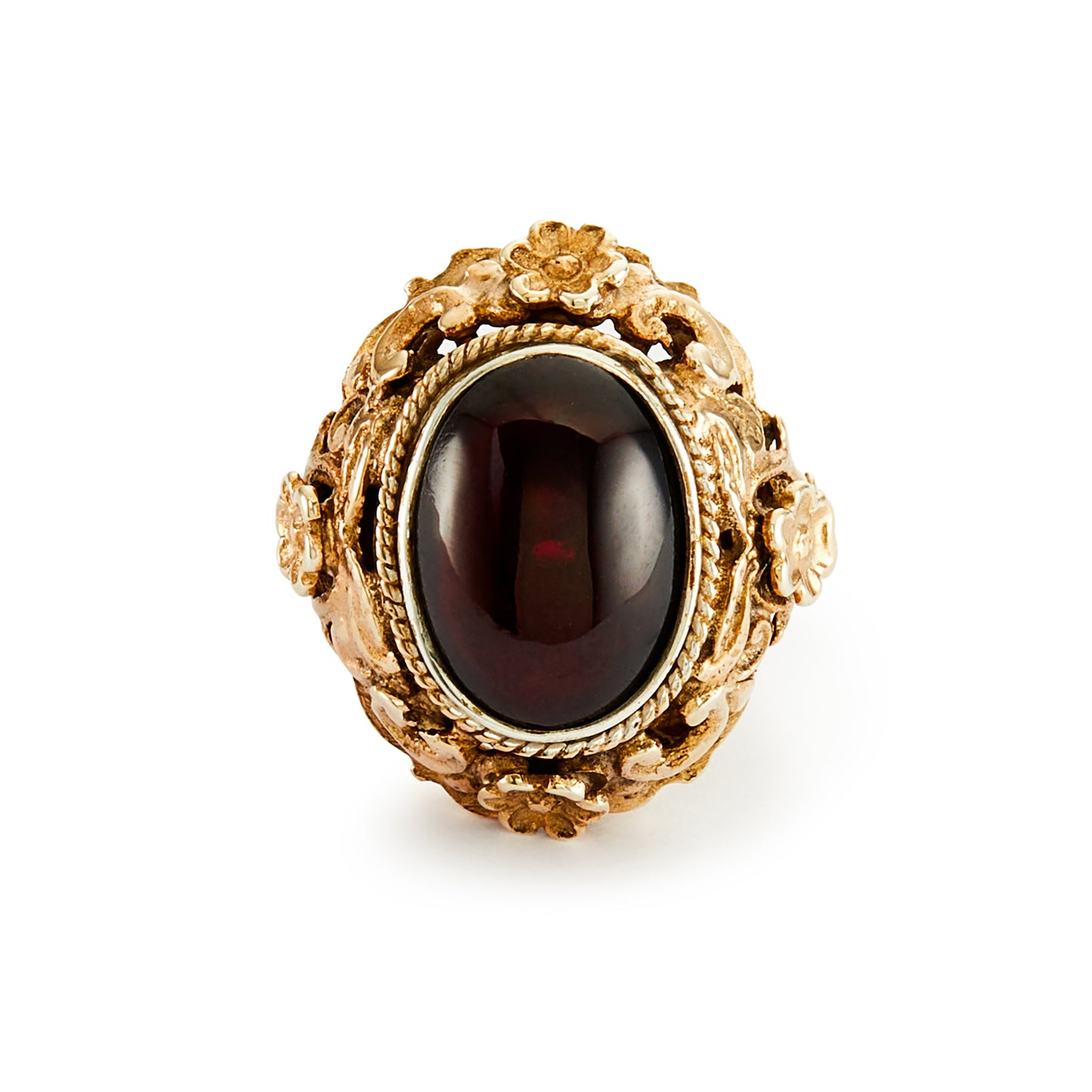 Exquisite Austro-Hungarian silver gilt ring with a beautiful cabochon garnet in an ornate floral setting. Circa 1900