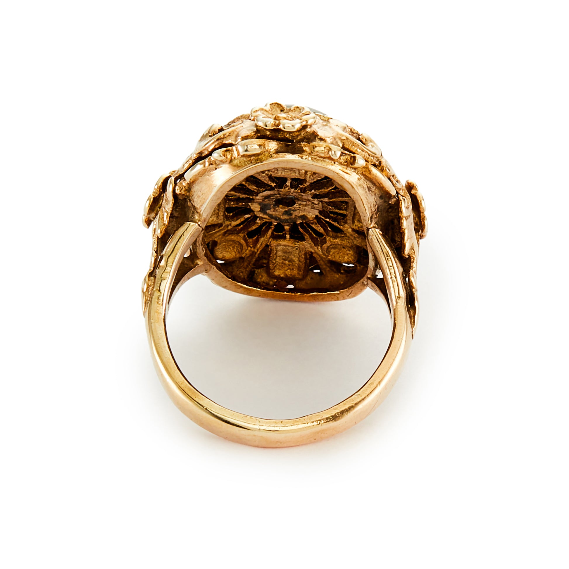 Exquisite Austro-Hungarian silver gilt ring with a beautiful cabochon garnet in an ornate floral setting. Circa 1900
