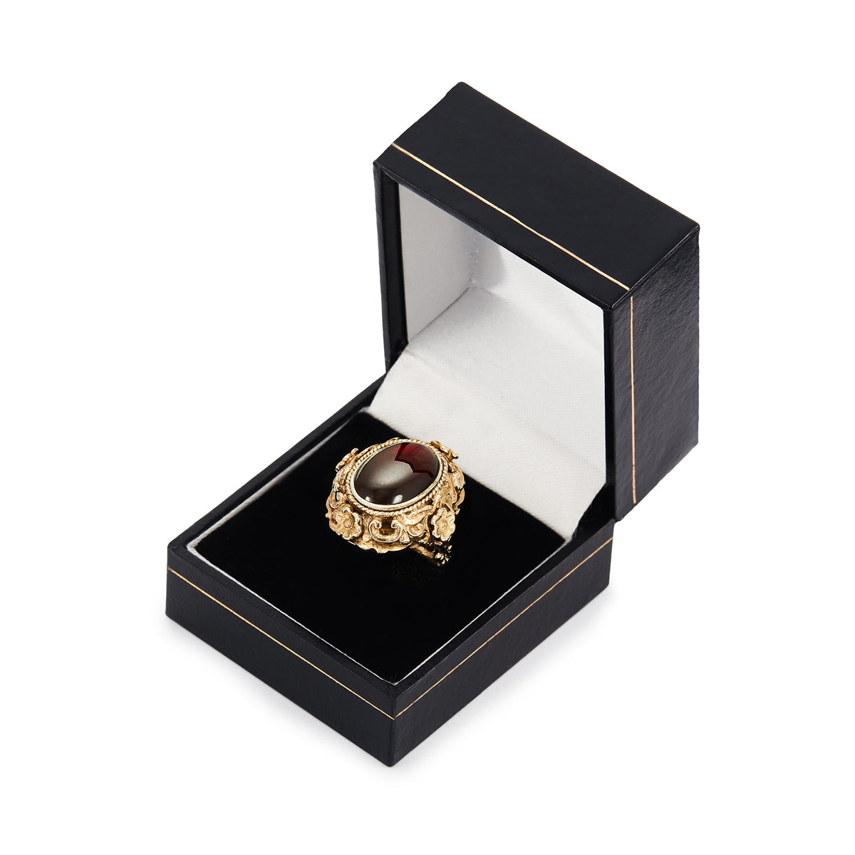 Exquisite Austro-Hungarian silver gilt ring with a beautiful cabochon garnet in an ornate floral setting. Circa 1900