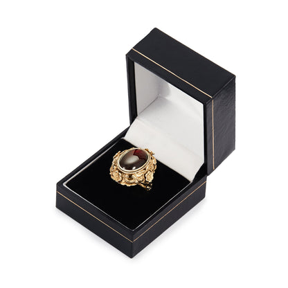Exquisite Austro-Hungarian silver gilt ring with a beautiful cabochon garnet in an ornate floral setting. Circa 1900