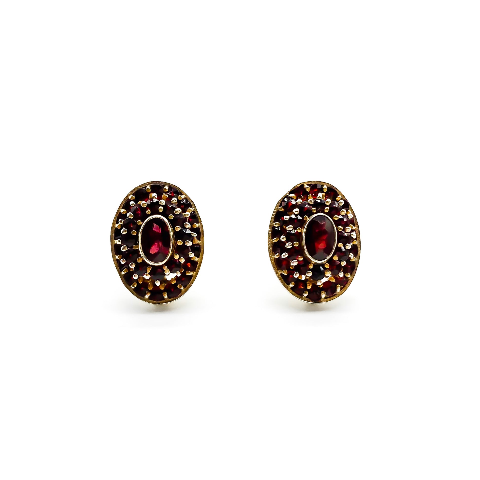 Lovely oval silver gilt stud earrings with garnets in a tier setting.