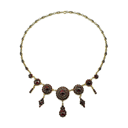 Lovely silver gilt festoon garnet necklace with five dangling drops. Circa 1930’s