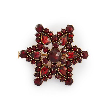 Lovely silver gilt brooch with beautifully faceted Bohemian garnets in a star setting. Circa 1930s