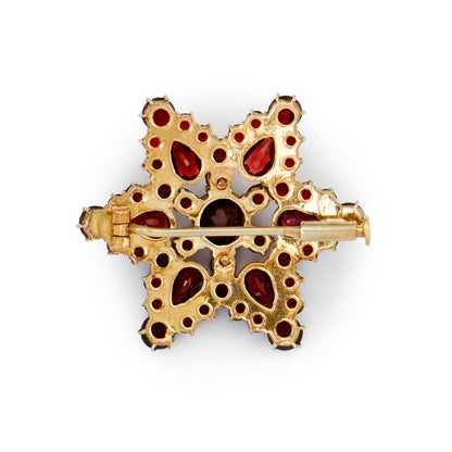 Lovely silver gilt brooch with beautifully faceted Bohemian garnets in a star setting. Circa 1930s