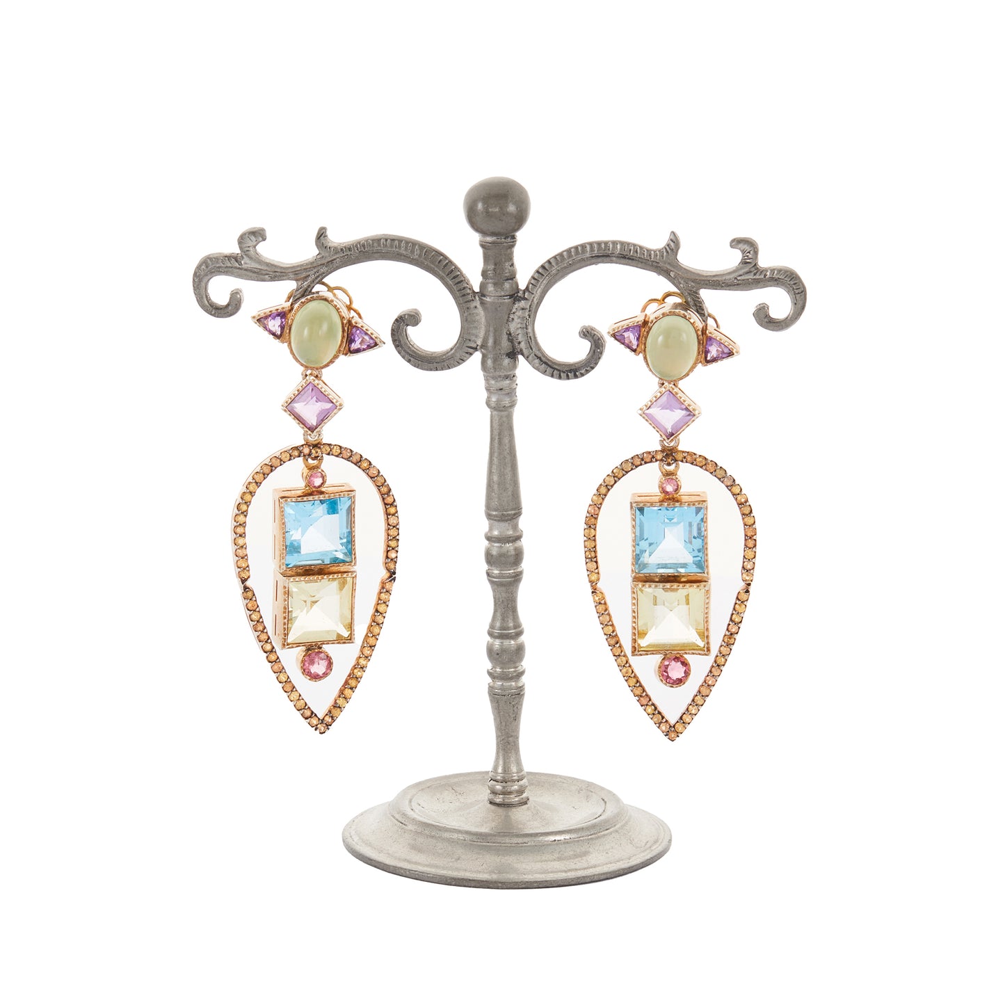 Glamorous antique-inspired silver-gilt pendant earrings set with a variety of faceted semi-precious gemstones (amethyst, green agate, blue topaz, citrine, pink tourmaline) in a geometric design. Unknown designer. London.