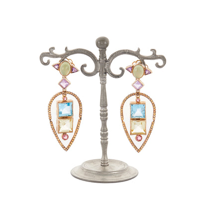 Glamorous antique-inspired silver-gilt pendant earrings set with a variety of faceted semi-precious gemstones (amethyst, green agate, blue topaz, citrine, pink tourmaline) in a geometric design. Unknown designer. London.