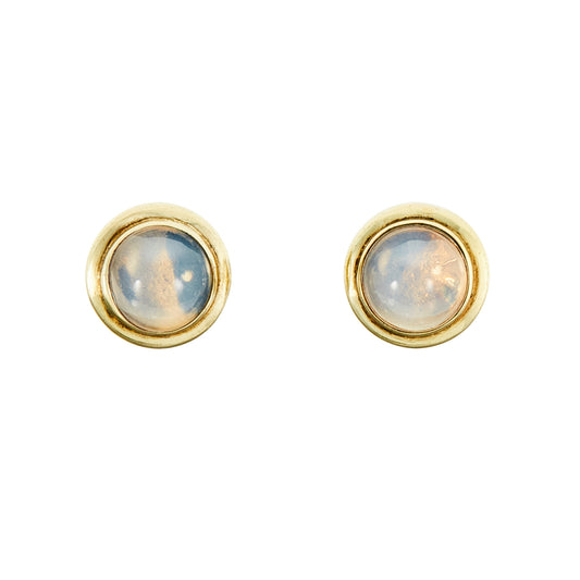 Exquisite vintage silver gilt stud earrings, each set with a luminous moonstone cabochon.