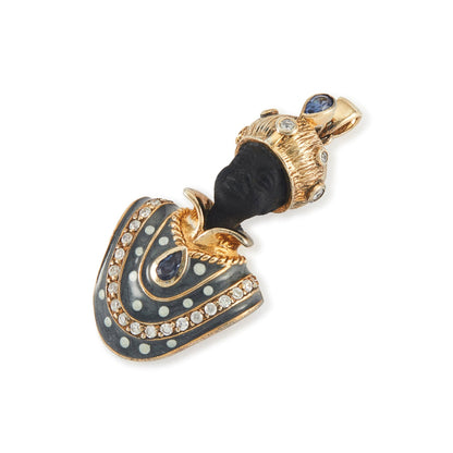 Very ornamental silver gilt figure pendant with resin face, beautiful blue enameling, set with two sapphires and white spinels.