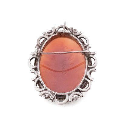 Unique silver brooch/pendant set with a beautifully carved rose cameo surrounded by marcasites. Circa 1930s