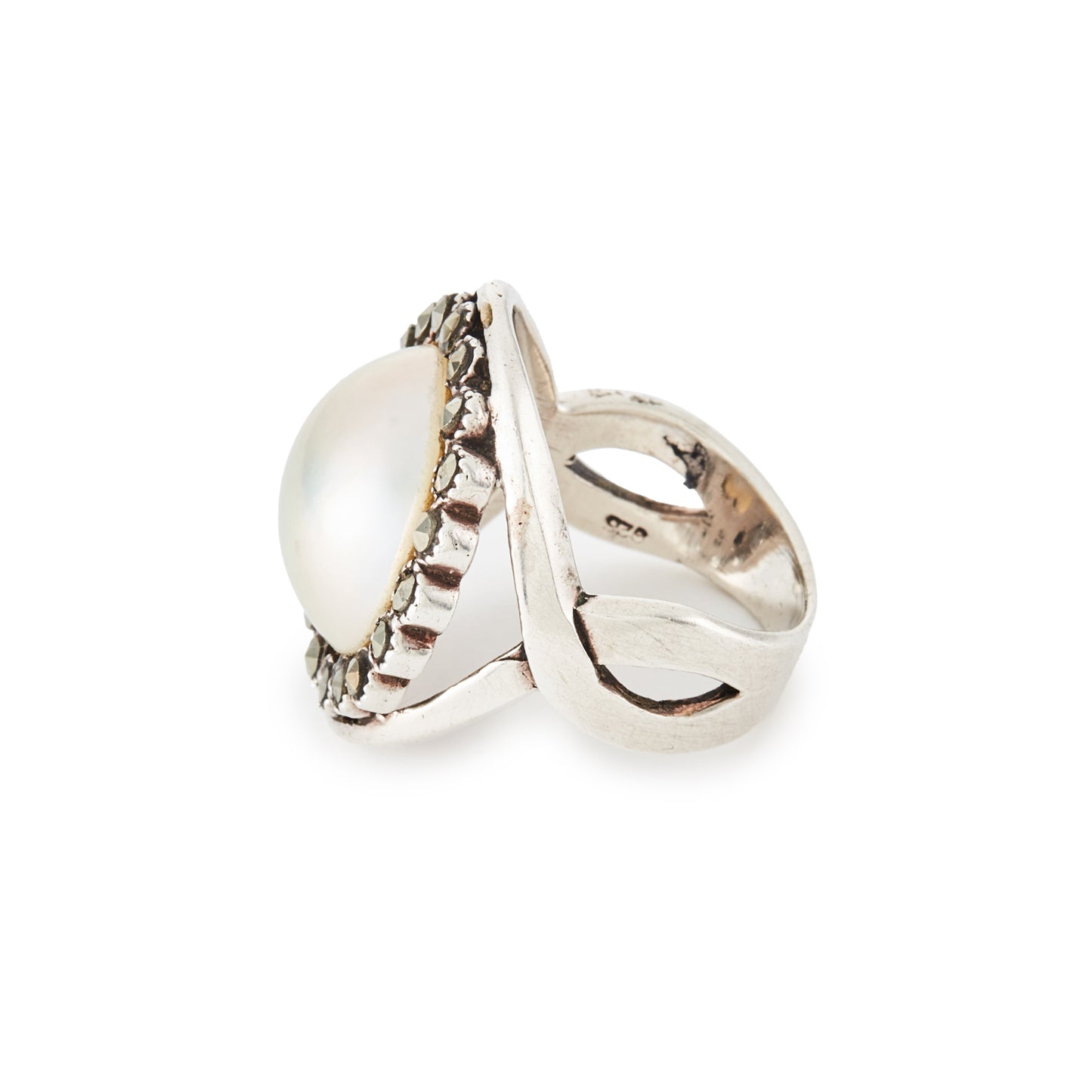 Glamorous vintage sterling silver ring set with a mabé pearl surrounded by nineteen marcasites.