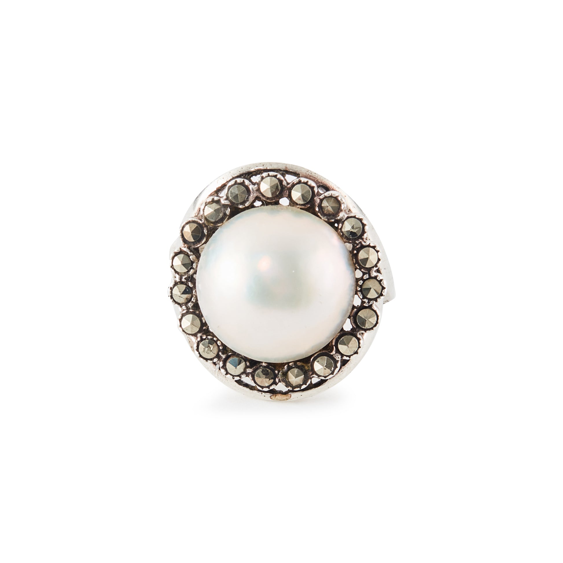 Glamorous vintage sterling silver ring set with a mabé pearl surrounded by nineteen marcasites.