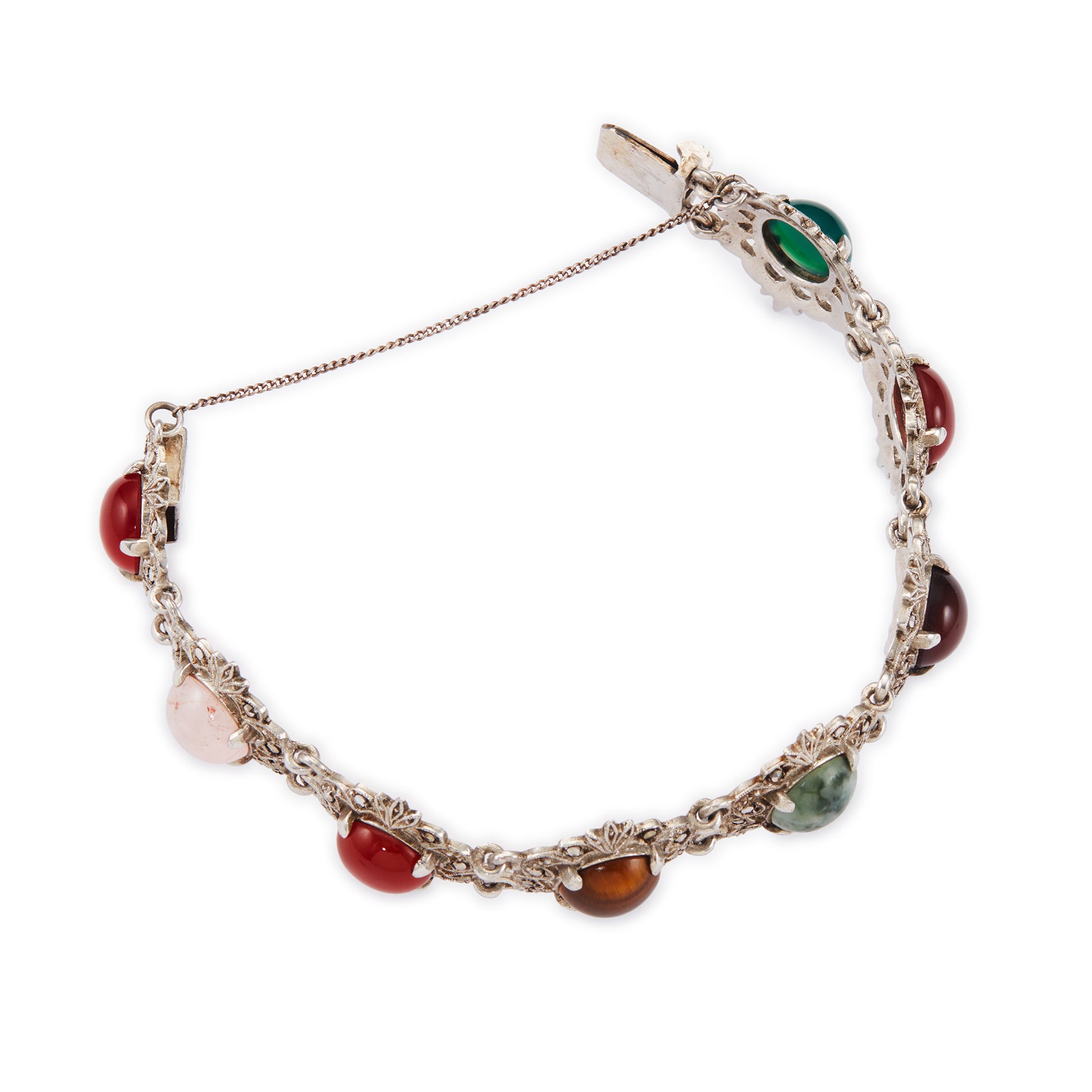 Stunning silver marcasite bracelet set with a combination of round cabochon gemstones: carnelian, rose quartz, tigers eye, moss agate, and chrysoprase in an intricate setting. Safety chain attached.