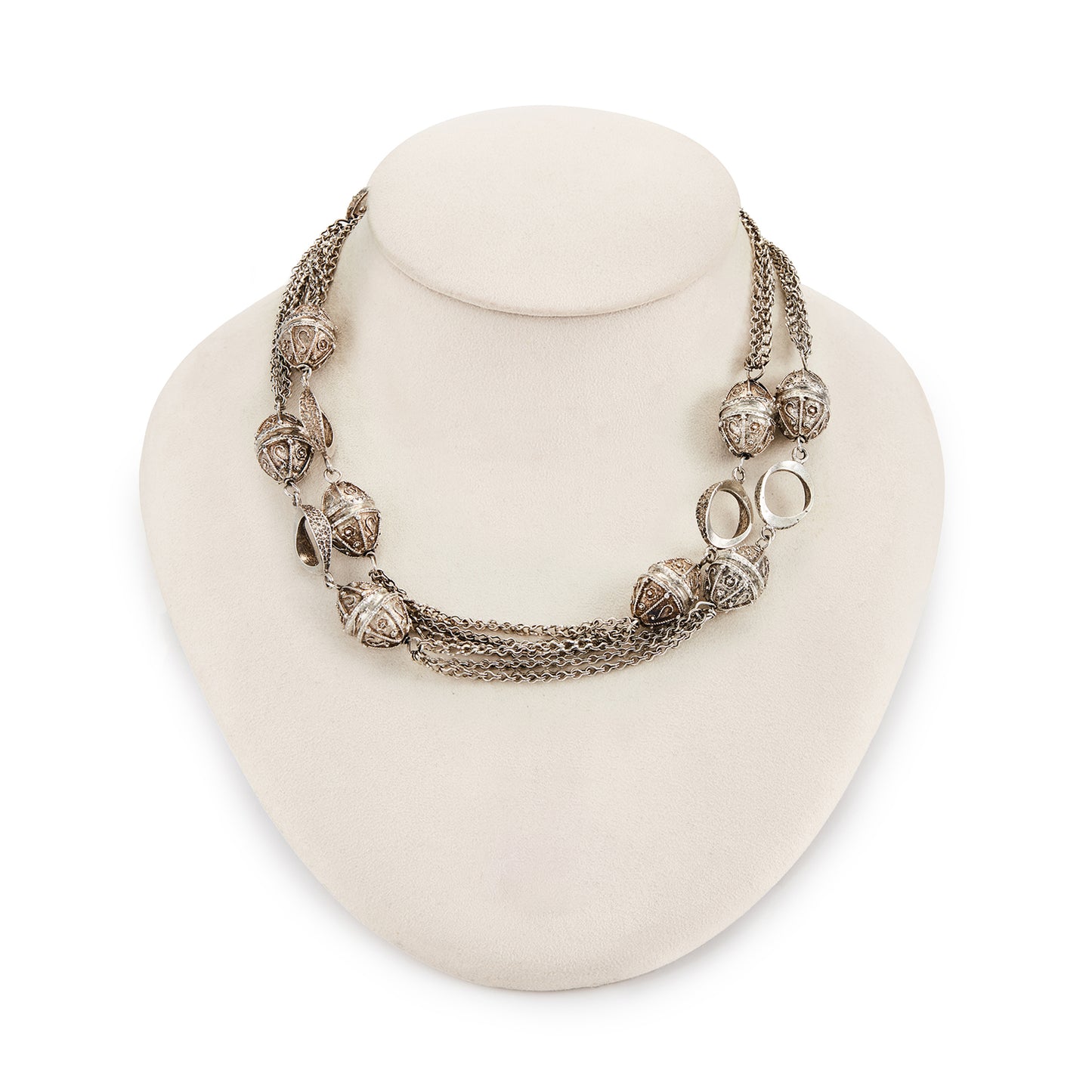 Long silver Mid-century necklace with ornate silver bobbles, connectors and multiple chains.