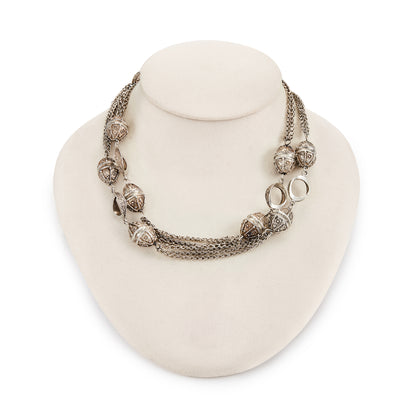 Long silver Mid-century necklace with ornate silver bobbles, connectors and multiple chains.