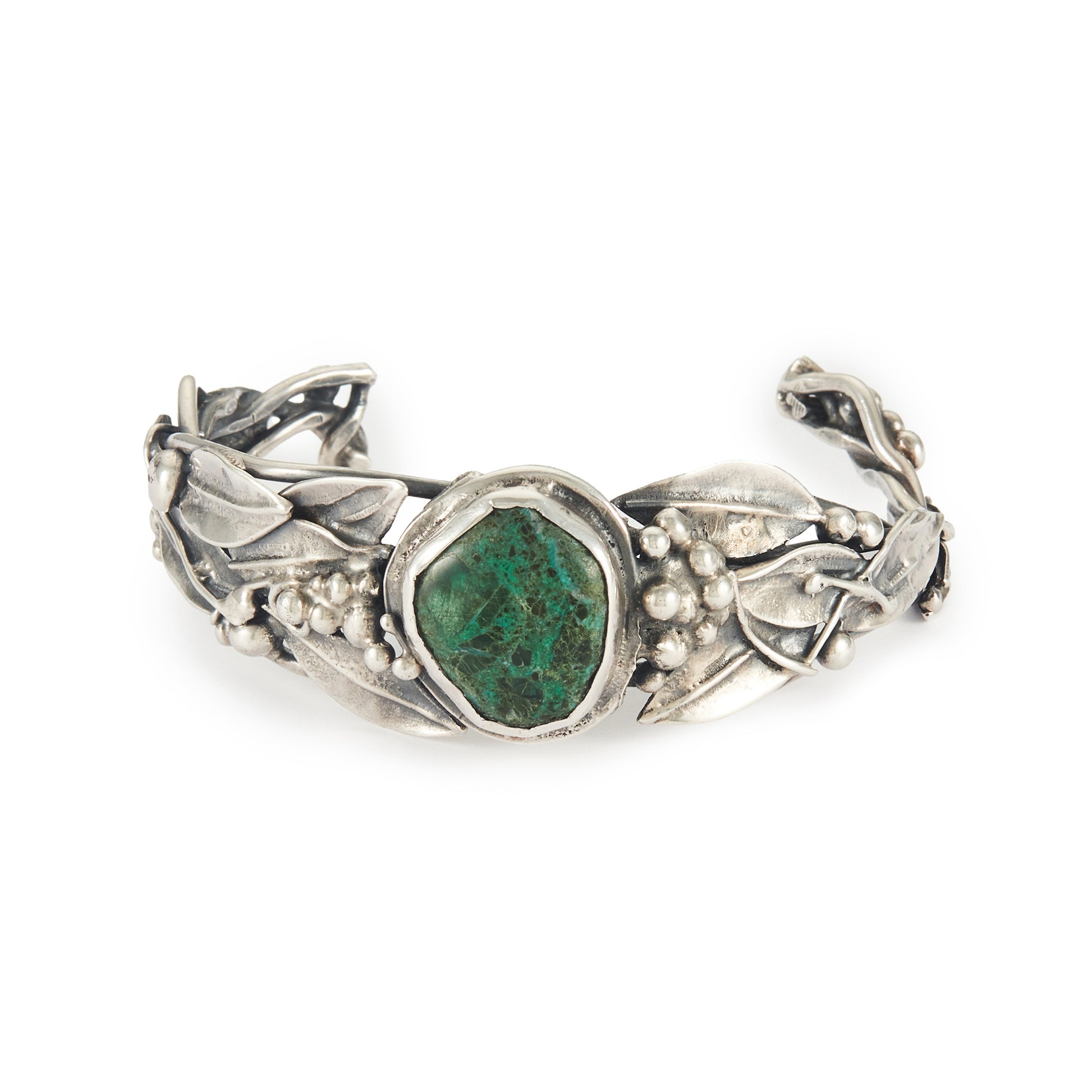 Stunning oxidised silver handmade bangle set with a dark green cabochon turquoise stone, surrounded by a leaf design. Ideal for a smaller wrist.