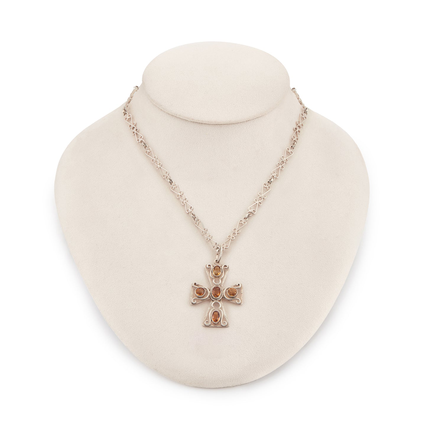 Lovely cross pendant set with five faceted citrines on an intricate fancy link  silver chain. Circa: 1930’s
