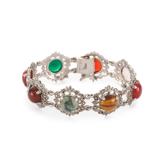 Stunning silver marcasite bracelet set with a combination of round cabochon gemstones: carnelian, rose quartz, tigers eye, moss agate, and chrysoprase in an intricate setting. Safety chain attached.