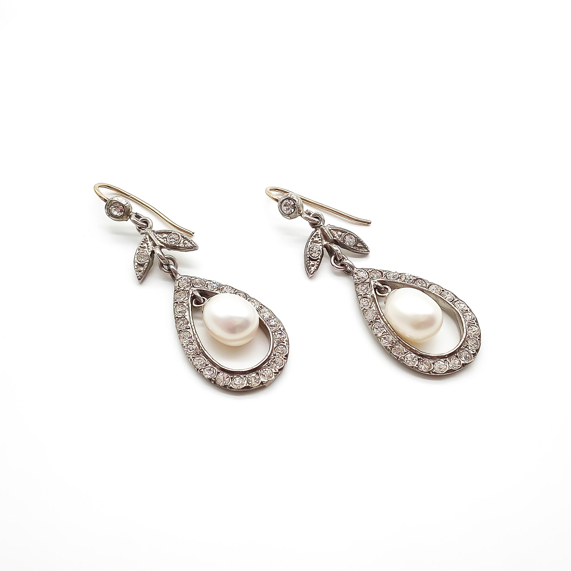Glamorous vintage sterling silver chandelier paste earrings with dangling pearl drops.