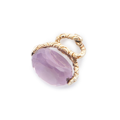 Lovely small 9ct yellow gold vintage swivel fob consisting of a beautifully faceted amethyst stone suspended from intertwined snakes.