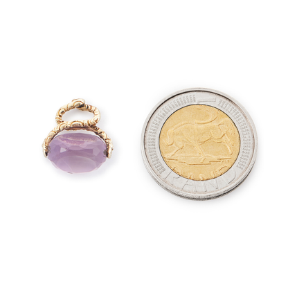 Lovely small 9ct yellow gold vintage swivel fob consisting of a beautifully faceted amethyst stone suspended from intertwined snakes.