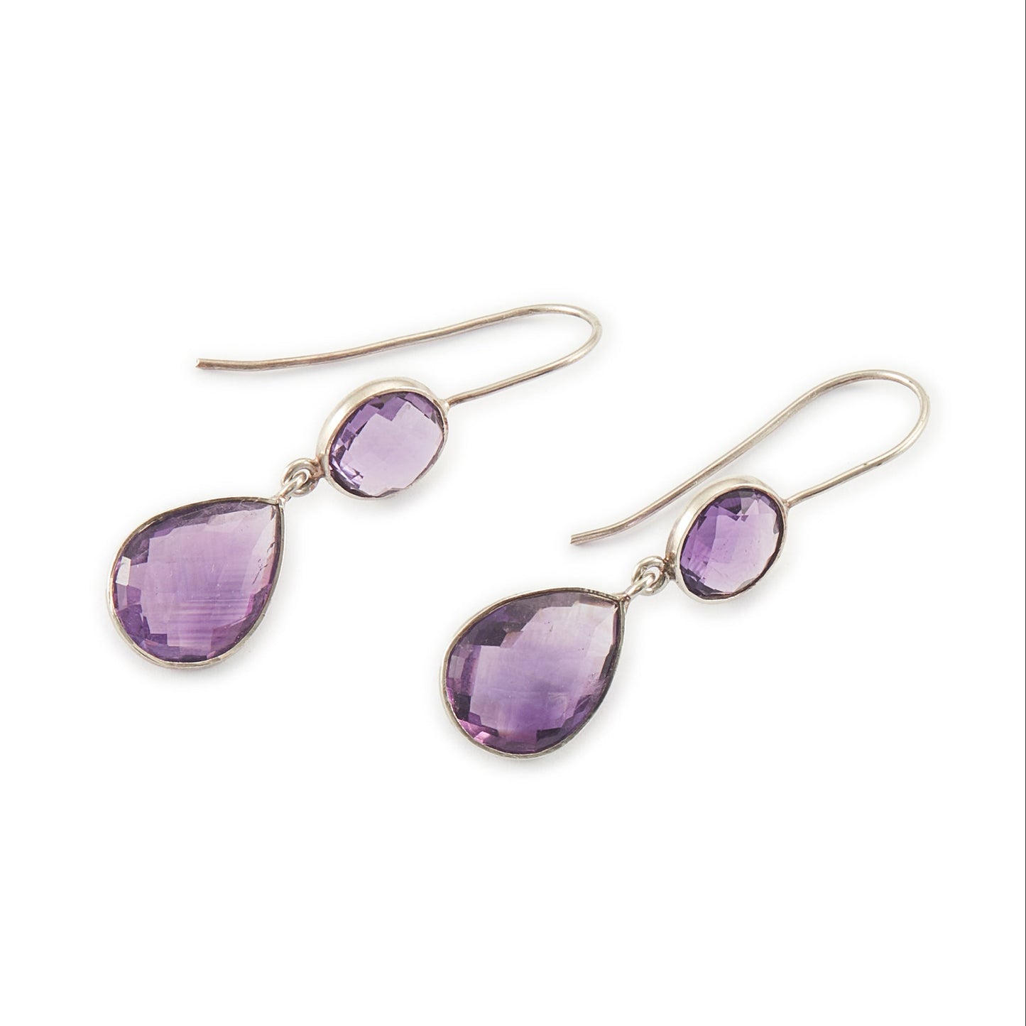 Lovely sterling silver pendant earrings, each set with a beautifully faceted round and teardrop amethyst.