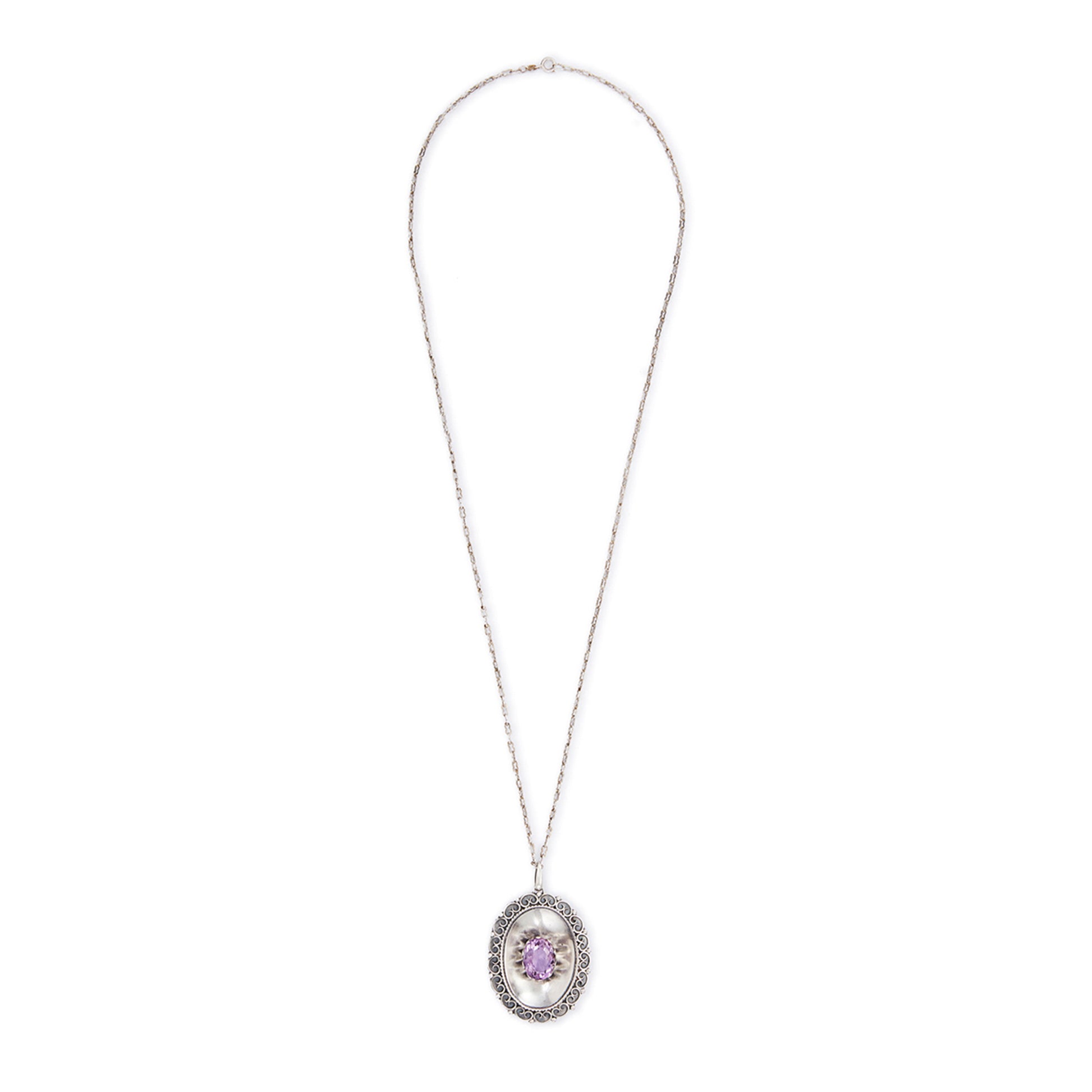 Magnificent Scottish sterling silver pendant centred with a large oval amethyst in a claw setting, with scroll work on the edges. The pendant hangs from an 82.1cm sterling silver fancy link chain.