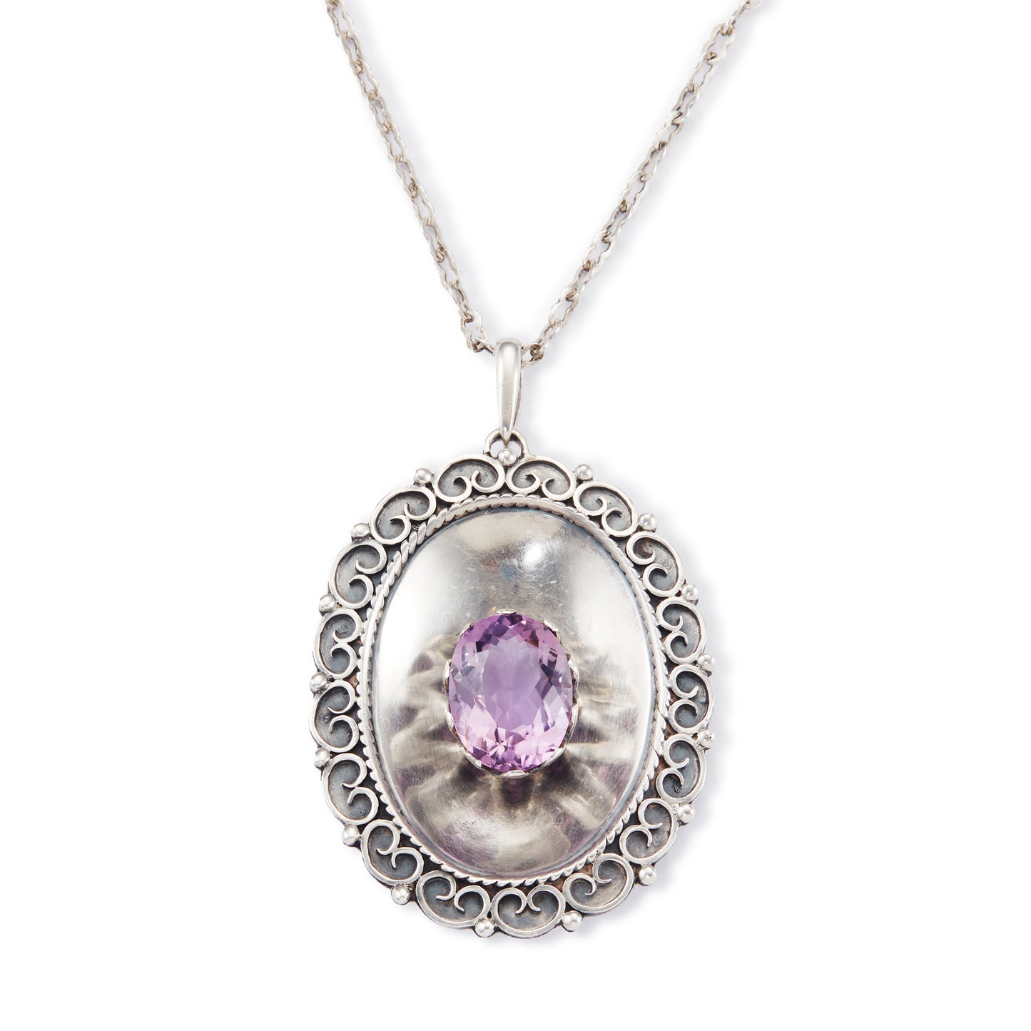 Magnificent Scottish sterling silver pendant centred with a large oval amethyst in a claw setting, with scroll work on the edges. The pendant hangs from an 82.1cm sterling silver fancy link chain.